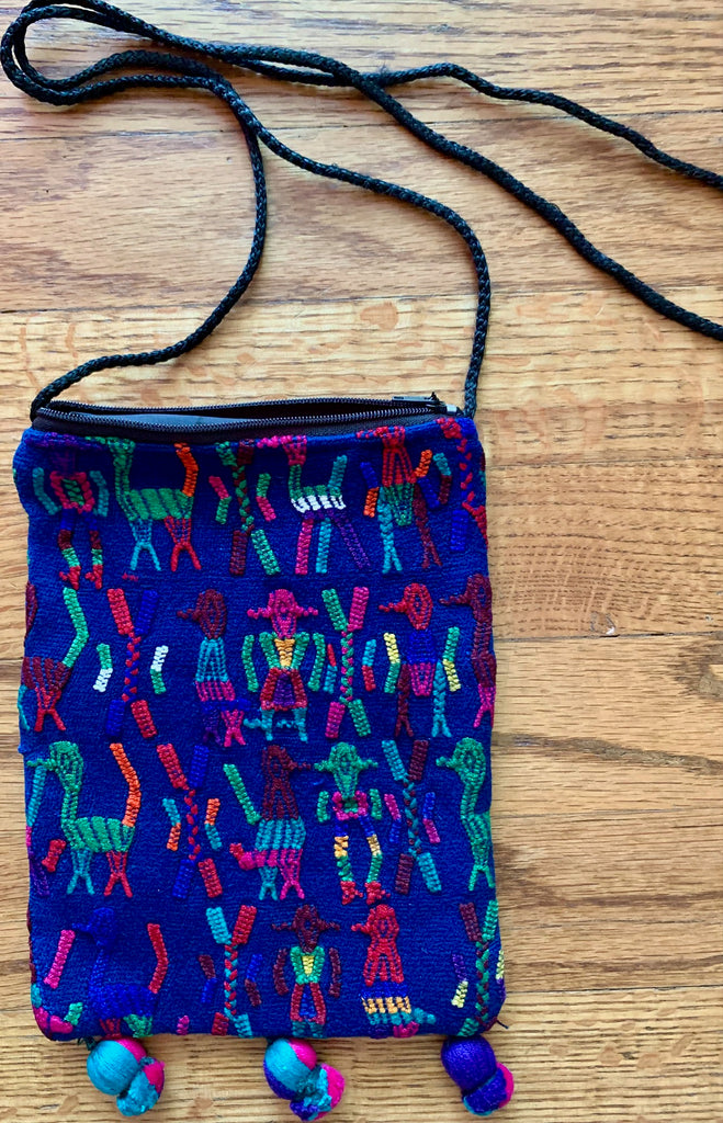 Pouch with pompoms and shoulder strap - additional pocket in back.