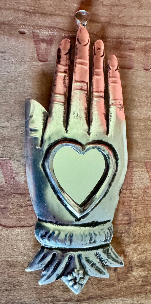 Hand with heart and mirror
